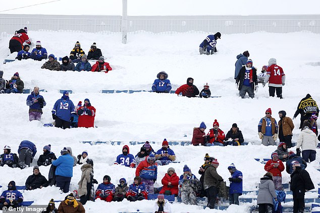 Fans take a seat in the snow for Monday's game between the Bills and Steelers