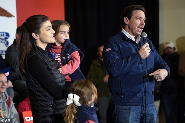 Florida Governor Ron DeSantis defeats President Joe Biden by three points in an election contest.  DeSantis campaigns in Ankeny, Iowa, on Sunday evening with wife Casey and their three young children, ahead of Monday's Iowa caucuses