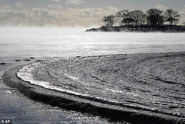 Steam rises from Lake Michigan along the shoreline in Evanston, Illinois, on Tuesday