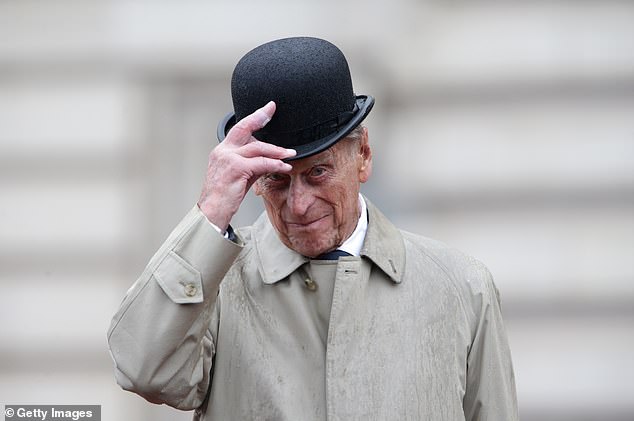 Prince Philip, Duke of Edinburgh, raises his hat in his role as Captain General of the Royal Marines