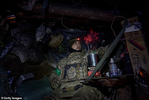 Ukrainian soldiers of the Ukrainian National Guard maintain their positions in the snow-covered Serebryan Forest