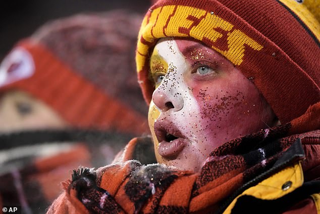 A young Chiefs fan watches during the second half of the playoff game against the Dolphins