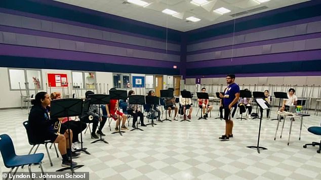 The band teacher (pictured teaching students) is employed by the United Independent School District, which says it has been in contact with authorities in Texas about the possibility of other victims.