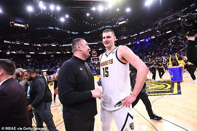 Milojevic is seen with his former student Nikola Jokic after a 2022 play-off match