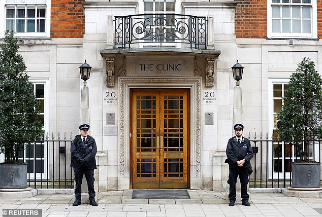 Police officers today stand outside the London Clinic where Kate is staying after the operation