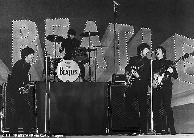 This photo, taken on June 30, 1966, shows British band The Beatles, (from left to right) Paul McCartney, Ringo Starr, George Harrison and John Lennon, performing at their concert at the Budokan in Tokyo