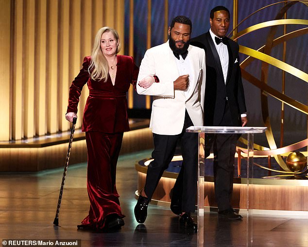 Christina – who was diagnosed with MS in 2021 – used a cane on stage at the Peacock Theater to walk alongside presenter Anthony Anderson, and was visibly in tears as the audience stood up and cheered for her