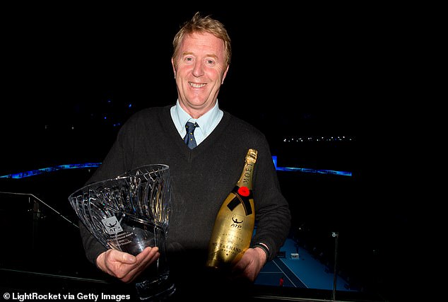 Dickson poses with the Ron Bookman Media Excellence Award he won in 2016