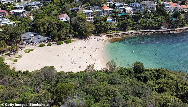 The woman, 32, was pulled from the water at Shelly Beach in Manly (pictured)