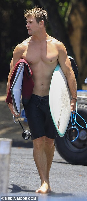 Thor star Chris (pictured), meanwhile, showed off his chiseled chest and bulging biceps in a pair of black trunks