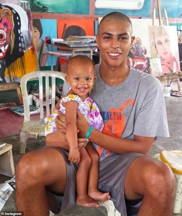 Mack's son Stella - whom she gave birth to while serving her overseas sentence in Indonesian prison - is pictured here with her father, Tommy Schaefer.  Mack's sentencing on Wednesday heard that Stella, now 8, 