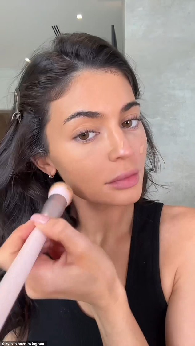 Using a flat brush, Kylie gently blended the complexion product into her skin