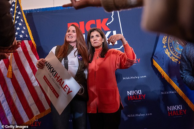 DeSantis' focus on South Carolina includes moving much of his staff to the state, a sign he believes he could perform well in rival Nikki Haley's home state.  Pictured: Former UN Ambassador Nikki Haley poses with a supporter during an event in Manchester, New Hampshire on Tuesday, January 16