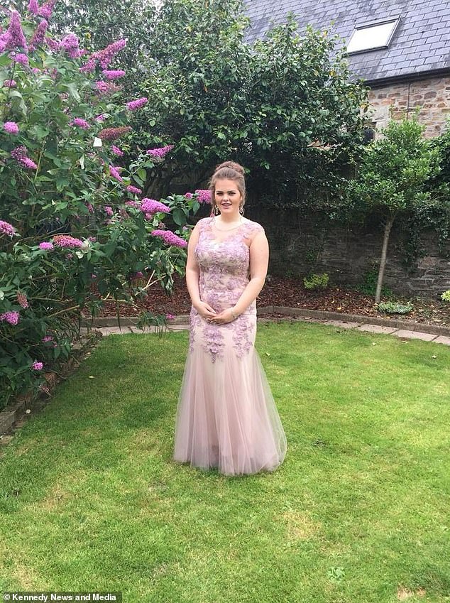 Holly is pictured in an elegant embroidered dress ahead of her 2017 prom