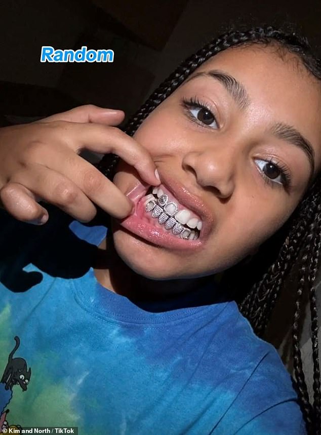 Kim Kardashian's 10-year-old daughter North West showed off her sparkly grill in a new TikTok video montage shared to their joint account on Wednesday