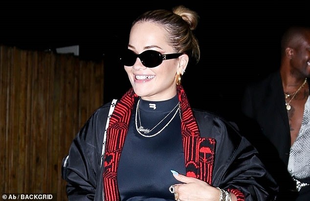 Turning heads: Rita Ora showed off a tooth gem while attending Zack Bia's party at The Nice Guy in West Hollywood in 2022