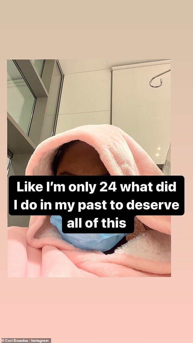 She followed it with a photo of her wearing a pink hoodie with a surgical mask over her face