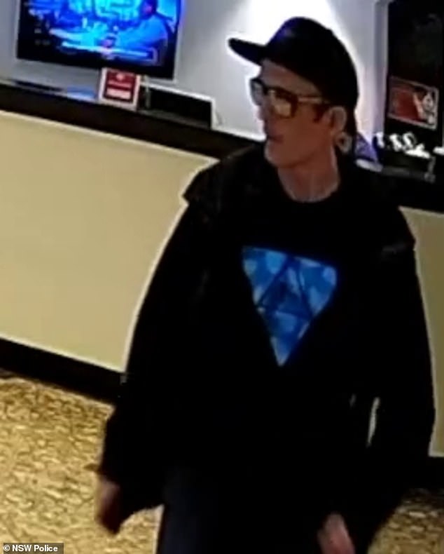 Police believe the man (above) in the footage could assist in the investigation into the death of a 43-year-old man in Sydney's CBD