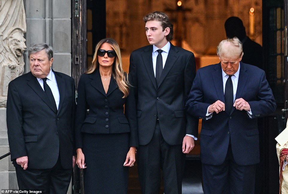 The teenager stood next to Donald Trump, Melania and Knavs' widower Viktor (left), dwarfing all three as they waited for the coffin to arrive on Thursday morning.