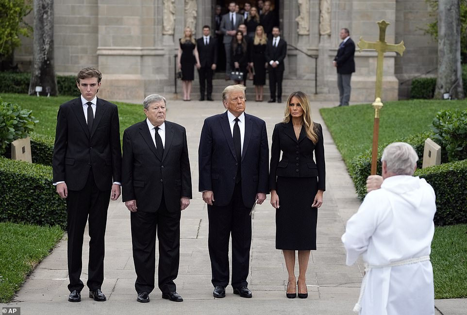 They walked slowly as a foursome to the church, in complete silence, as dozens of police officers looked on, the three men in black suits and ties and Melania in a black jacket, black skirt and a silver cross around her neck.