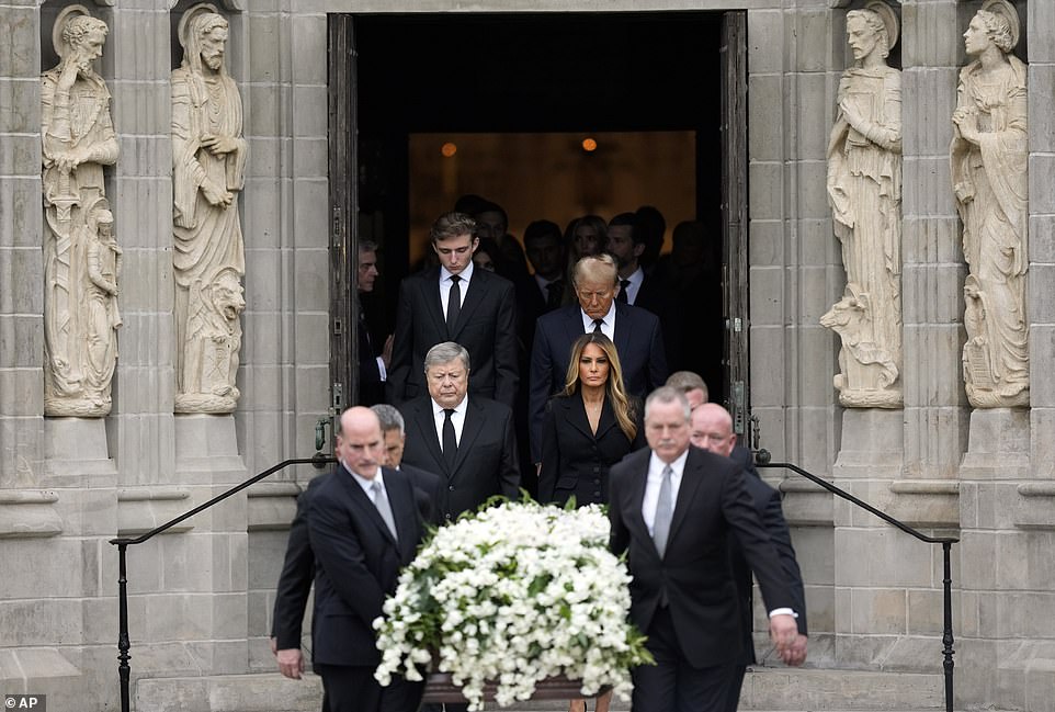 All four came out of the church just behind the coffin, which was carried by six pallbearers