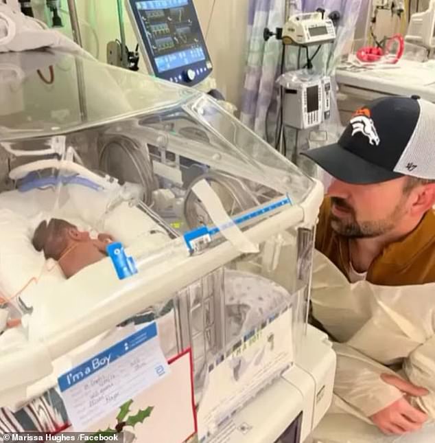 Baby Judah, pictured with Hughes' husband Rawley, was born prematurely at 22 weeks and weighed one pound.  Due to ongoing health complications, he required an extended hospital stay