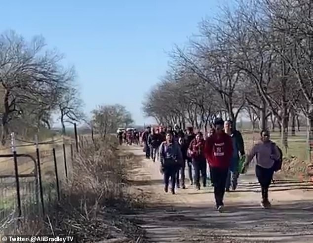 Dozens of migrants spotted on a private ranch near Normandy, Texas, are undeterred by US politics