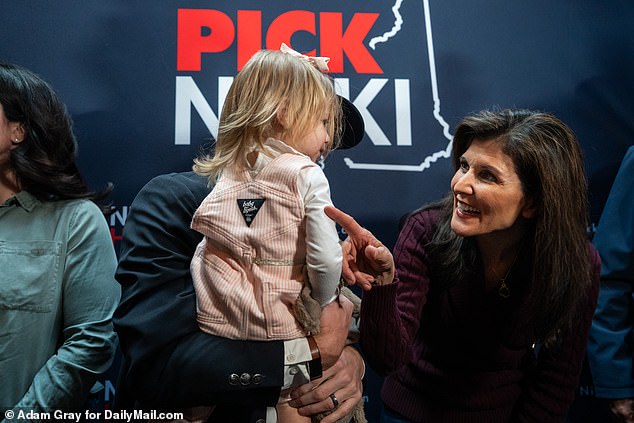 Nikki Haley says hello to Bianca Schimmel, 1, and her father Stephen