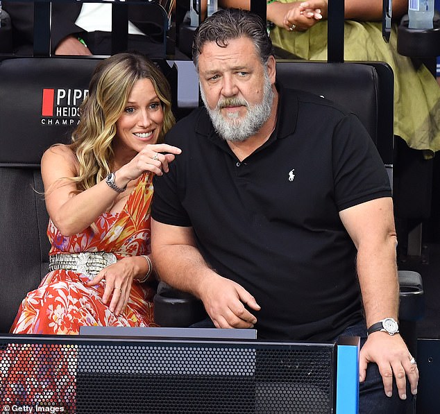 Russell Crowe and his girlfriend Britney Theriot took center stage at last year's men's singles final (pictured) as Djokovic took his 10th Australian Open crown