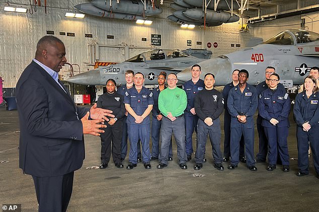 Austin addresses crew members on the USS Gerald R. Ford on December 20.  Two days later he went to hospital for a planned prostate cancer operation, but was discharged and readmitted a week later