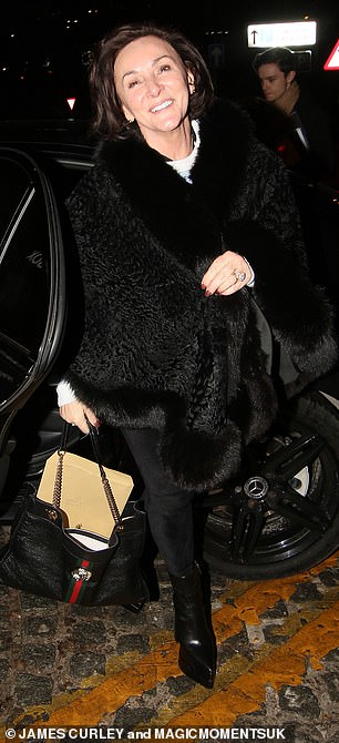 Shirley, 63, looked effortlessly chic as she donned a glamorous black coat and elegant matching trousers