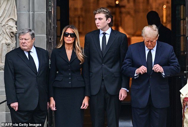 Barron Trump stood next to Donald Trump, Melania and Knavs' widower Viktor (left), dwarfing all three as they waited for the coffin to arrive Thursday morning.