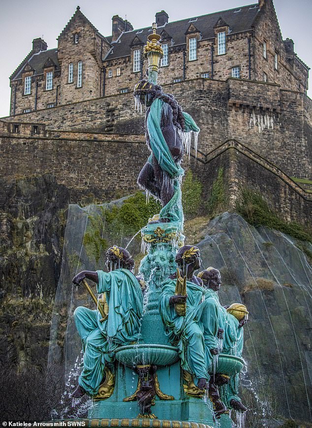 Advice was issued as a wave of cold weather swept across Britain.  Pictured: The Ross Fountain in Edinburgh's Princes Street Gardens frozen over as temperatures dropped