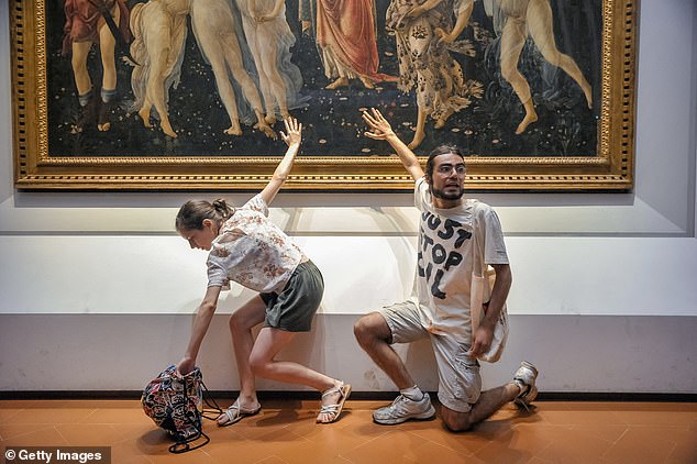 Three environmentalists attached themselves to the glass cover of the iconic Renaissance painting in the Sala Botticelli of the Uffizi Gallery in Italy in July 2022