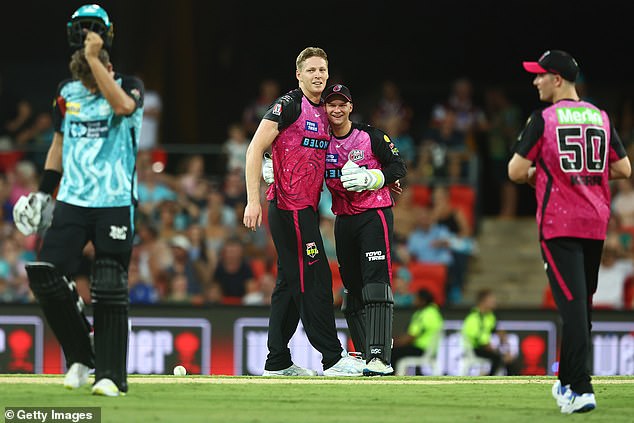 Brisbane Heat's Spencer Johnson (left) hit a ball back to Edwards, and the tail batsman was stunned as the young gun stuck out his right hand to claim a reflex catch he won't soon forget