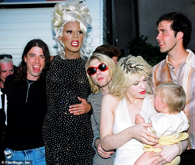 Kurt Cobain, center, is seen with RuPaul, Dave Grohl, far left, and Nirvana's Krist Novoselic, far right, and Courtney Love with daughter Frances Bean Cobain