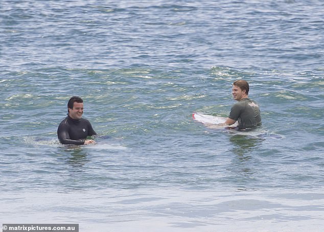 The boys were all smiles as they paddled out to catch more waves