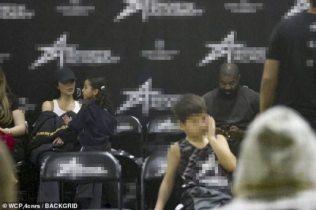 Despite the cordial conversation, the former couple still sat a few seats apart as their eldest son played with his youth basketball team.