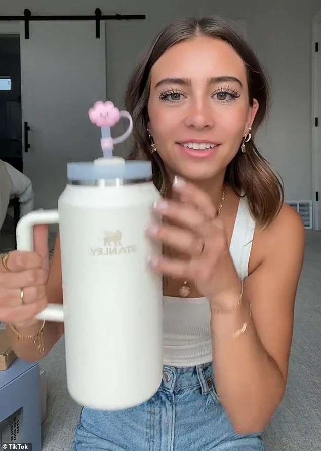 A year later, she now has her own influencer account (not pictured) – where she proudly shows off the fruits of her parents' efforts to over 137,000 followers.  Unrelated Stanley influencer Hallesoswag shows off one of the color-coded cups on TikTok