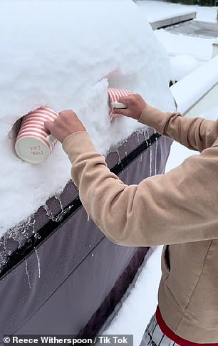 In the clip, the 47-year-old The Big Little Lies star starts by scraping snow off her car with two mugs before covering the snow with salted caramel and chocolate syrup