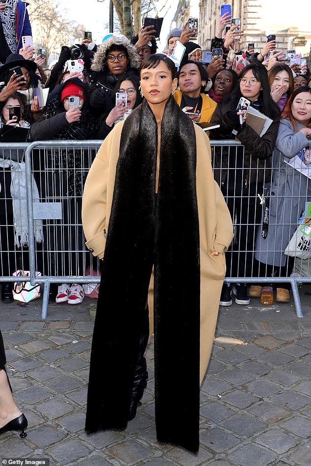 Harry Styles' girlfriend Taylor Russell turned heads in a tan trench coat worn under a brown floor-length scarf