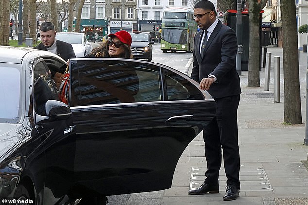 Nancy was helped into the car by her driver, who also took her luggage