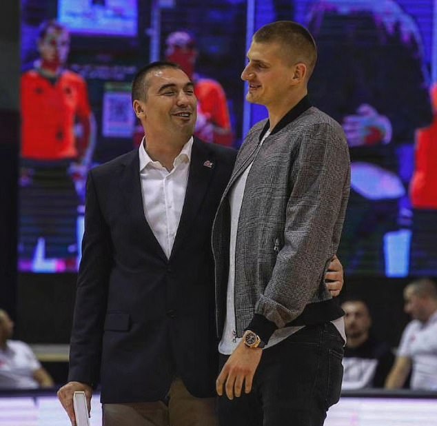 Milojevic is seen with his arm around his former student Jokic after coaching him in Belgrade