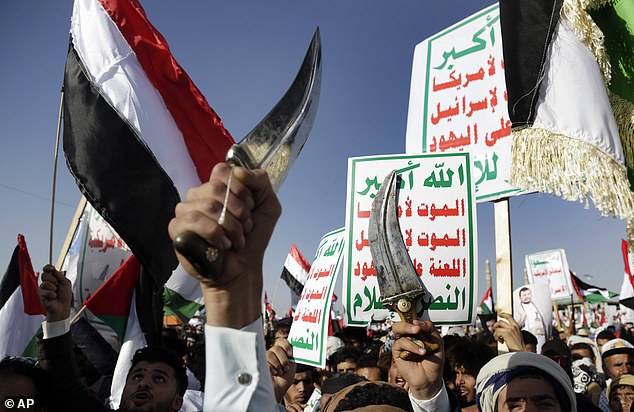 Houthi supporters attend a protest against the US-led airstrikes in Sanaa, Yemen on Friday, January 12, 2024