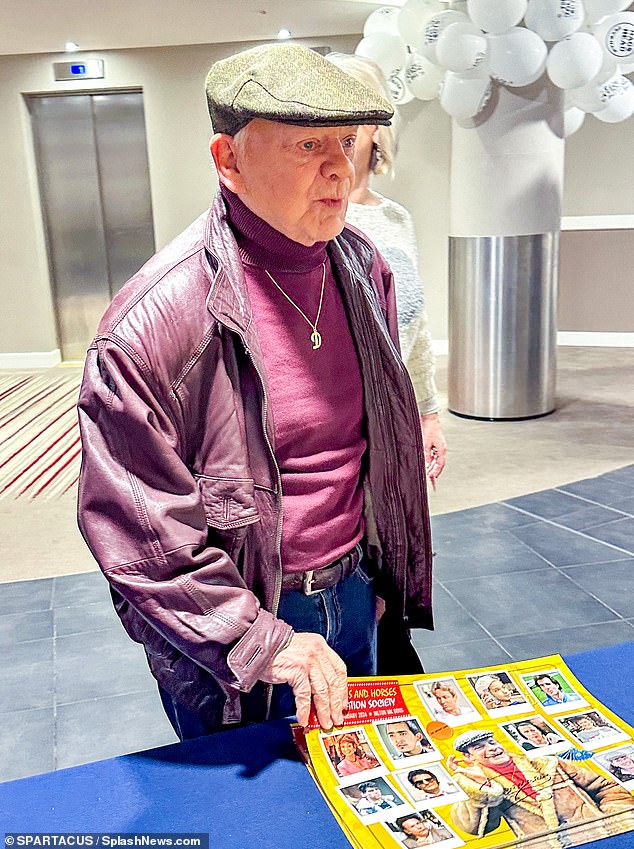 He wore a maroon polo collar, complete with a matching leather bomber jacket, jeans and trainers, while wearing his signature baker boy hat and signature gold 'D' chain.