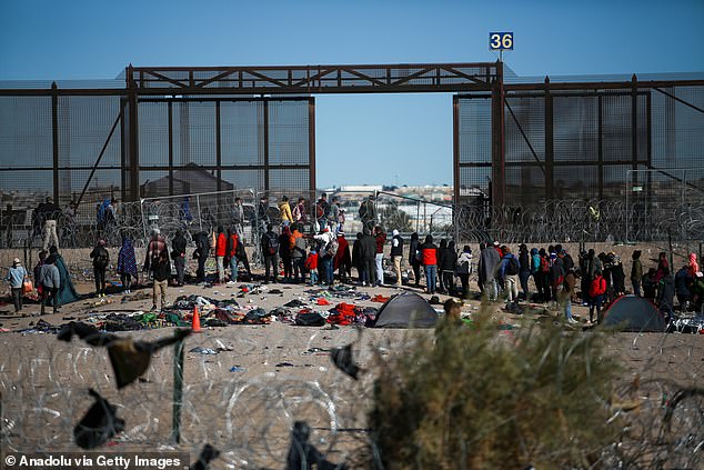 People camp while waiting to cross the border between Mexico and the United States in Ciudad Juarez, Mexico