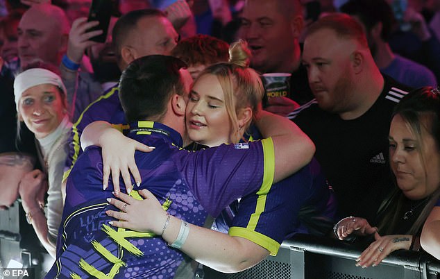 Littler and his partner can be seen together during the PDC world darts final on January 3