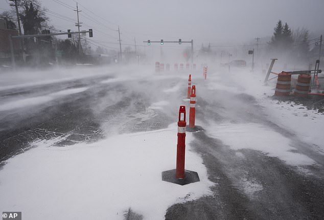 The wind blew snow across the SW Pacific Highway in Portland, Oregon, on January 13, 2024.