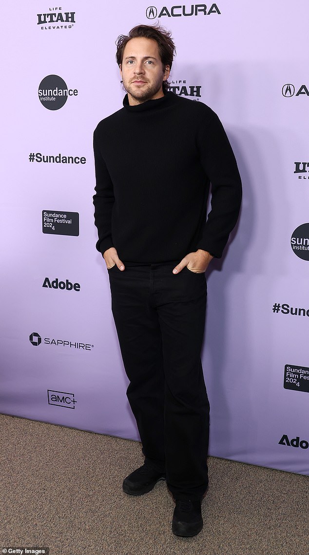 Producer Tom Ackerley, 33, showed his support in an all-black ensemble