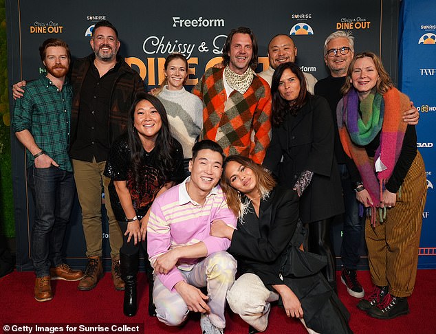 She later joined Booster alongside their cast and crew for a cheerful group photo on the red carpet